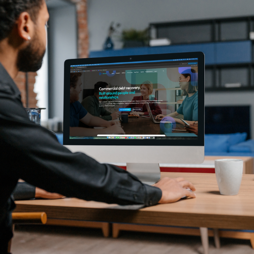Business owner viewing the Rezolva commercial debt recovery website
